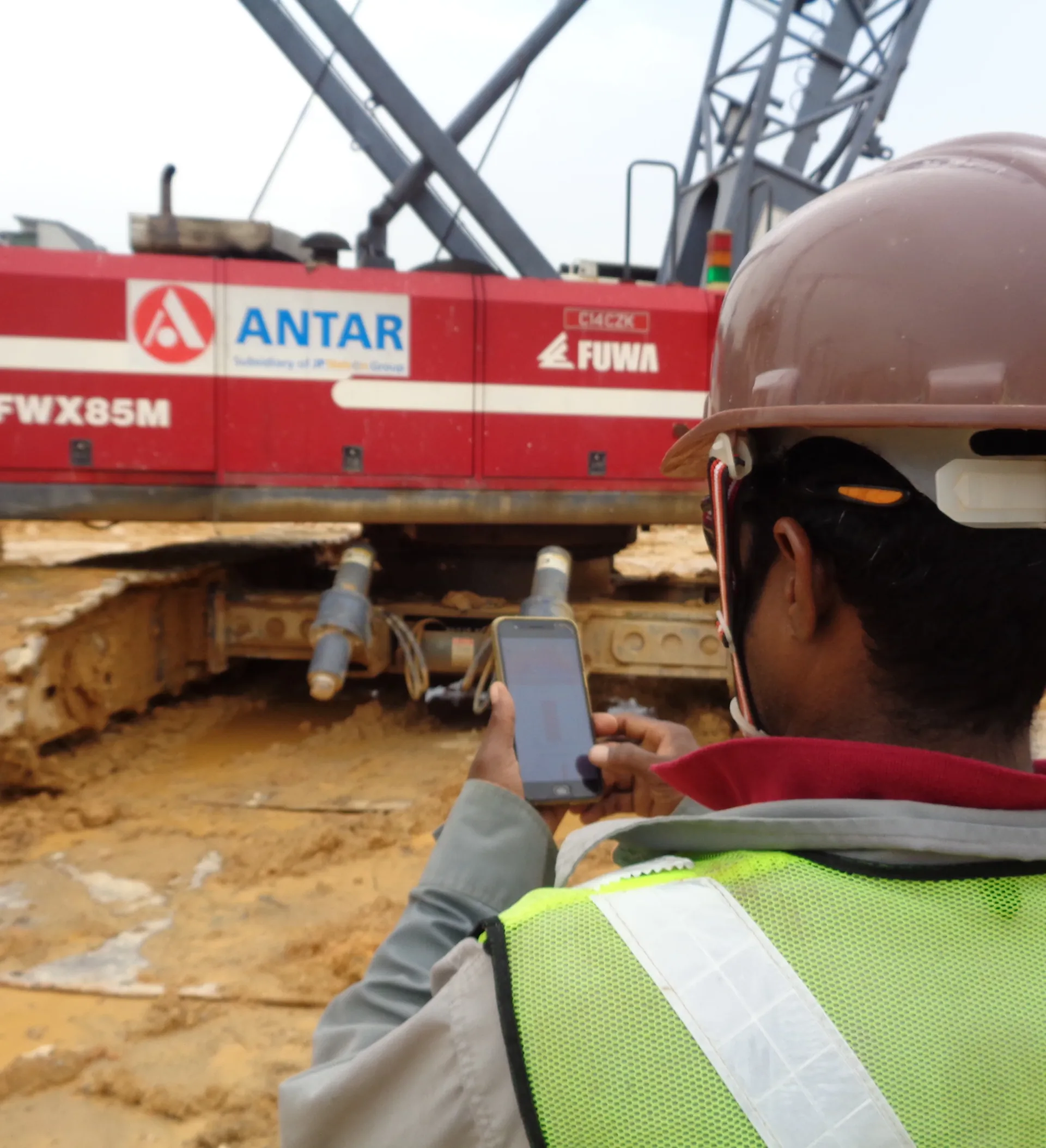 Workers on a construction site covered by a permit to work